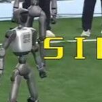 Robot hình người AgiBot sút phạt vượt qua hàng rào mô hình người màu vàng trên sân bóng
