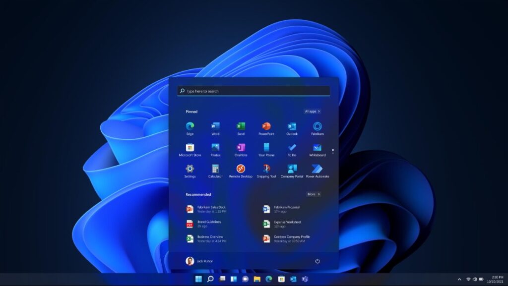 Laptop Windows 11 hiển thị màn hình đăng nhập trên bàn làm việc