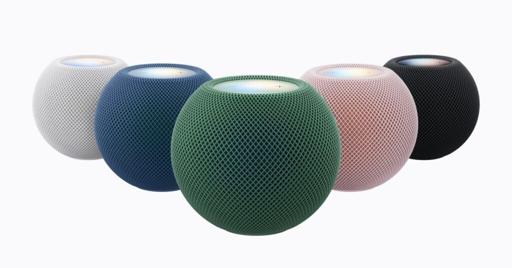 HomePod mini 2 đặt trên bàn với phần mặt trên phát sáng